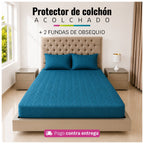 Referencia visual de un protector acolchado color turquesa con dos fundas de almohada; el diseño del acolchado puede variar